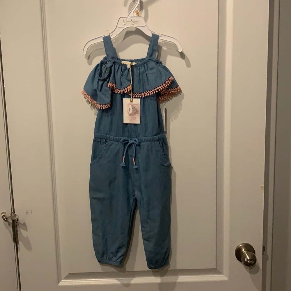 Jumpsuit, light blue with light pink trim.